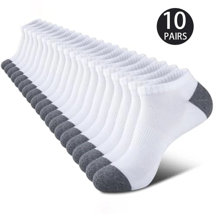 A stack of 10 pairs of white sports socks, displayed neatly.
