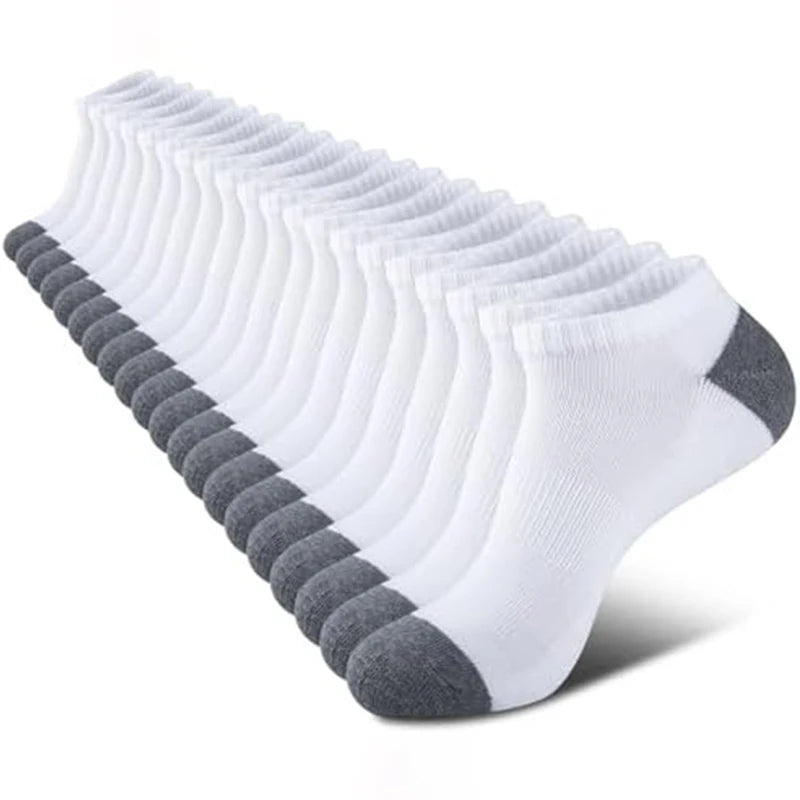 A stack of white cushioned sports socks neatly arranged.
