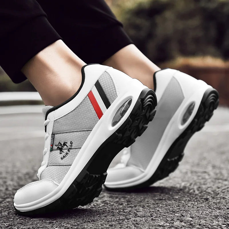 Stylish white and black sneakers paired with jeans for a trendy and casual look.

