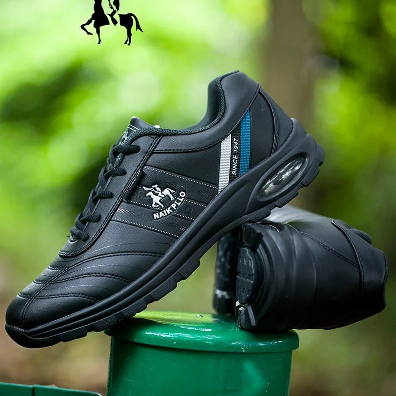 Men's black sneakers with stylish detailing placed on a green post outdoors.