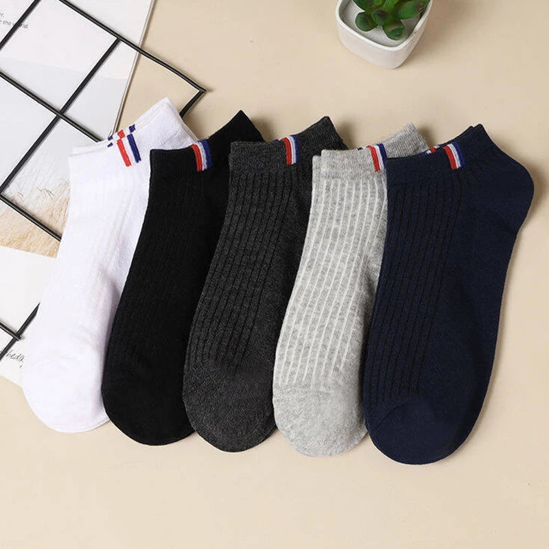 5 pairs of men's cotton socks in different colors, displayed to show stretch and comfort.
