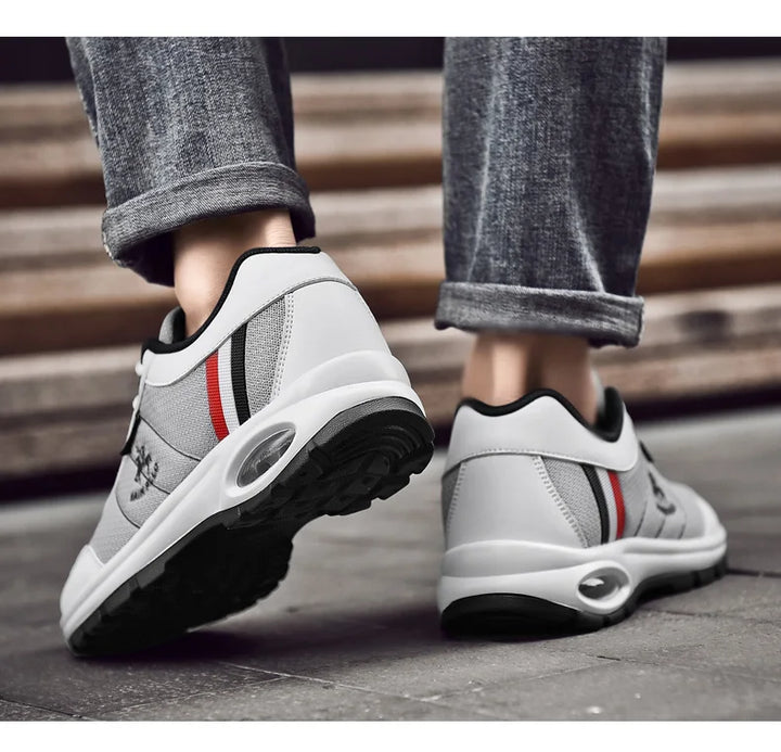  Man walking in stylish white sneakers, showing flexibility and fit.